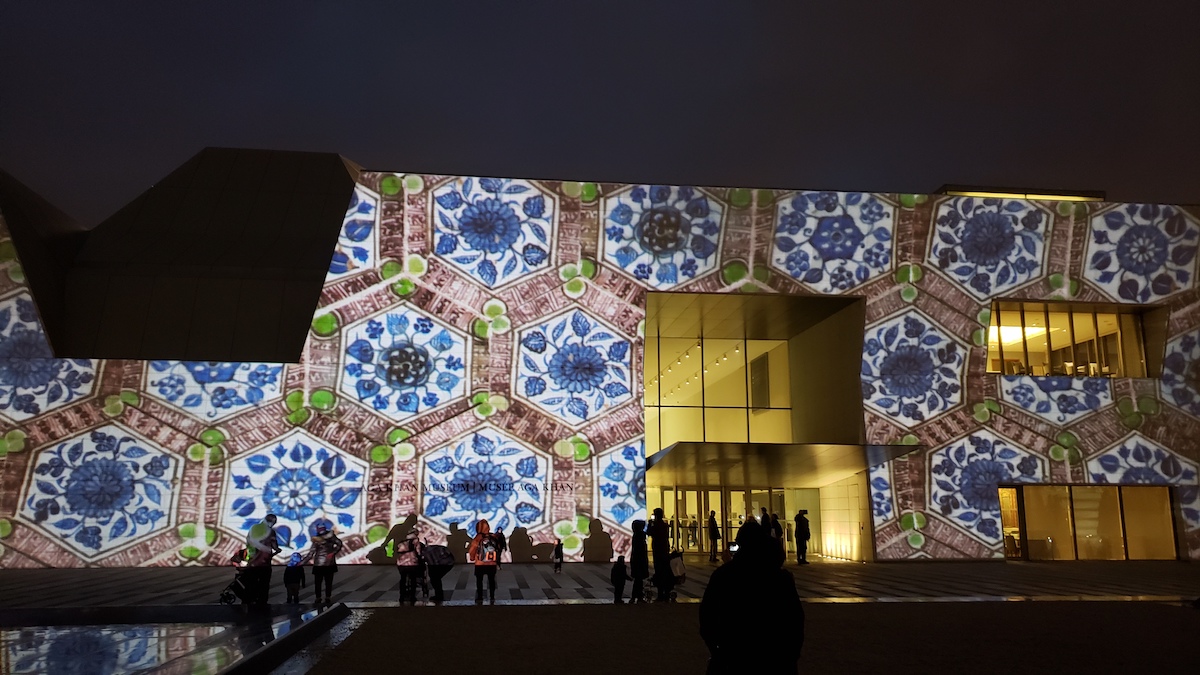 The Museum's facade covered with a blue floral-esque pattern.